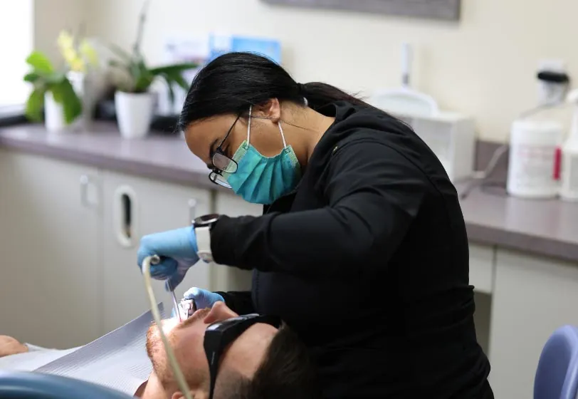 man getting his teeth cleaned at Serenity Dental in Spokane, WA